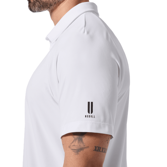 Men's White NOBULL All Fore It Polo Side U NOBULL Logo Angle.
