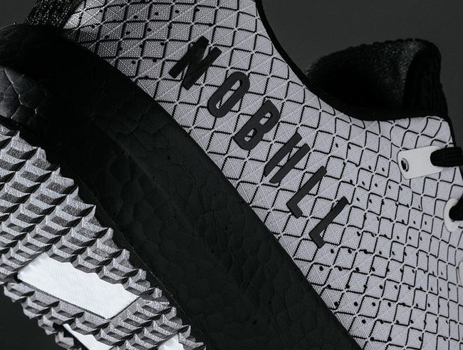 Close up detail shot of the cream drive ripstop shoe featuring the NOBULL logo