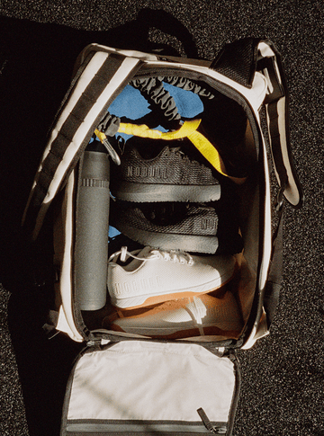 Backpack filled with NOBULL shoes.
