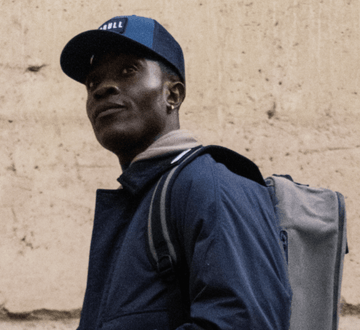 Man wearing NOBULL hat.