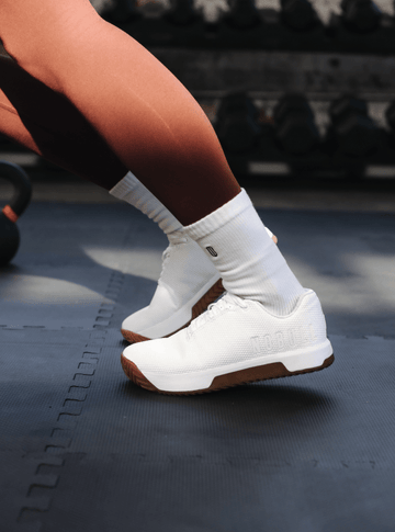 Woman working out in Outwork Edge shoes.