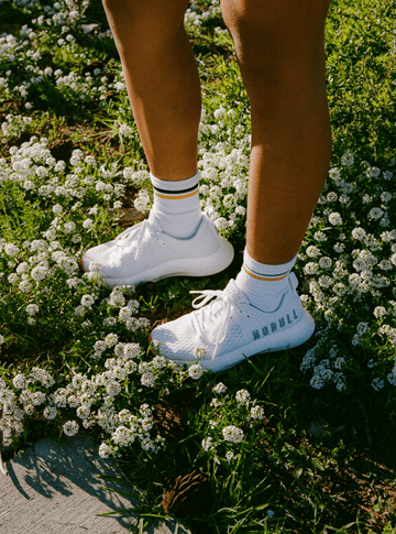 Woman wearing Journey shoes on grass.