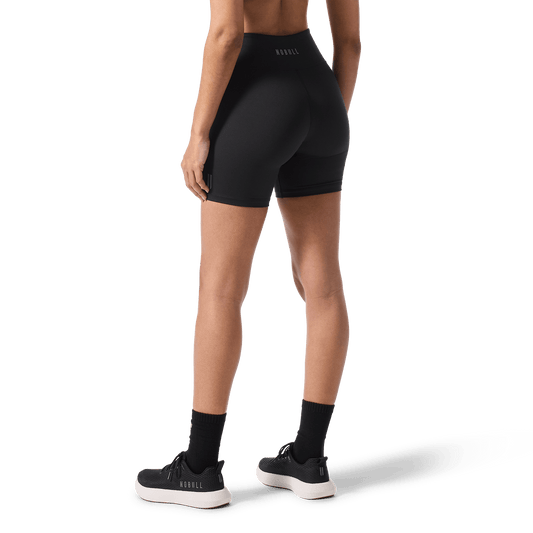 Women's Black U High-Rise Matte Short 6" Back Lower Body Angle.