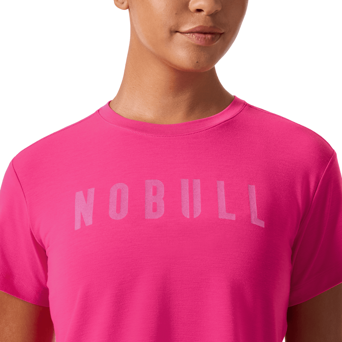 Women's Signal Pink NOBULL Boxy Tee Front Detail Angle.