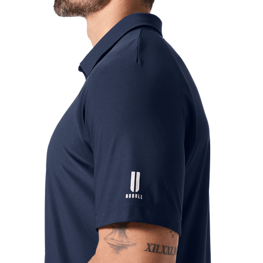 Men's Night Navy NOBULL All Fore It Polo Side U NOBULL Logo Angle.