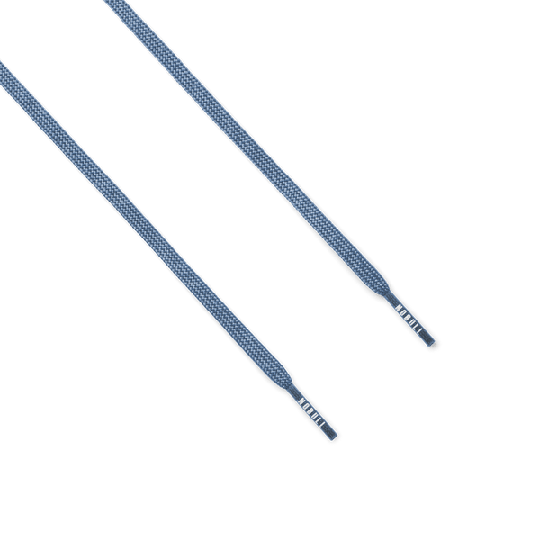 Pair of light blue shoelaces on a white background.