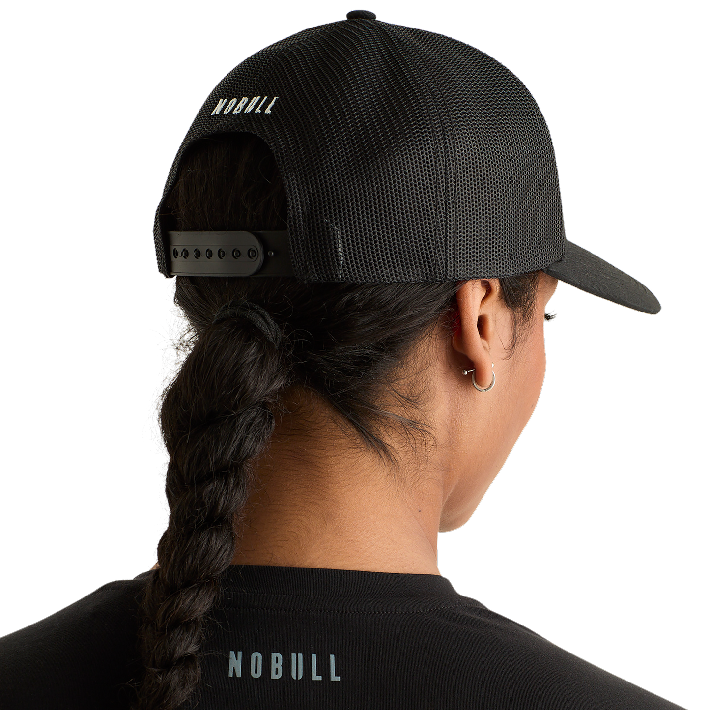 Woman Wearing Black Be U Trucker Hat Back Angle.
