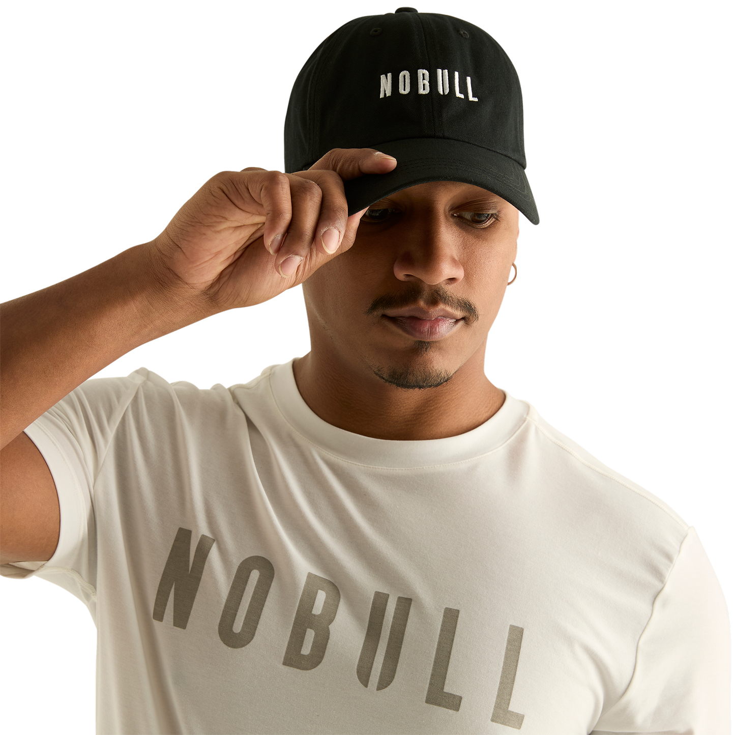 Man wearing black NOBULL hat - front facing