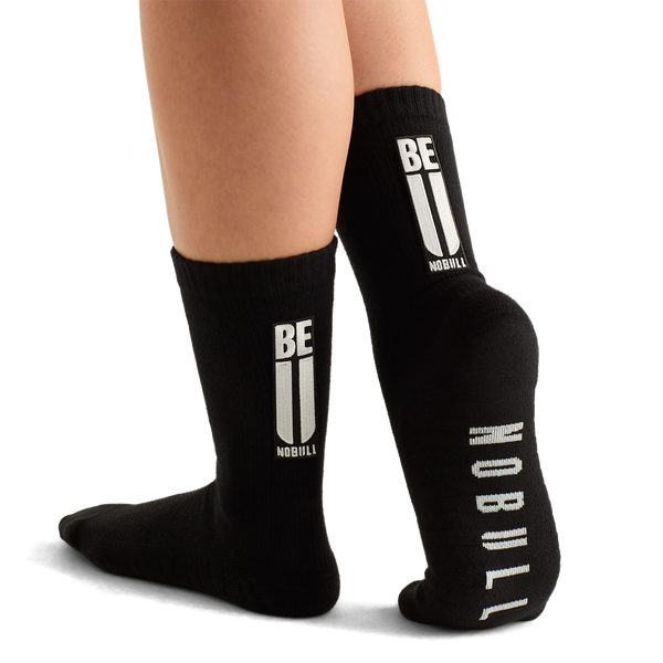 Woman Wearing Black Be U Crew Sock.