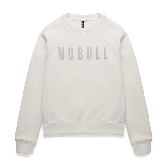 
                        Women's Cream NOBULL Crew Sweatshirt Flat Lay Angle.
                      