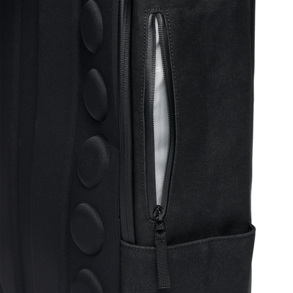 Black Waxed Canvas Backpack Side Zipper Pocket Angle