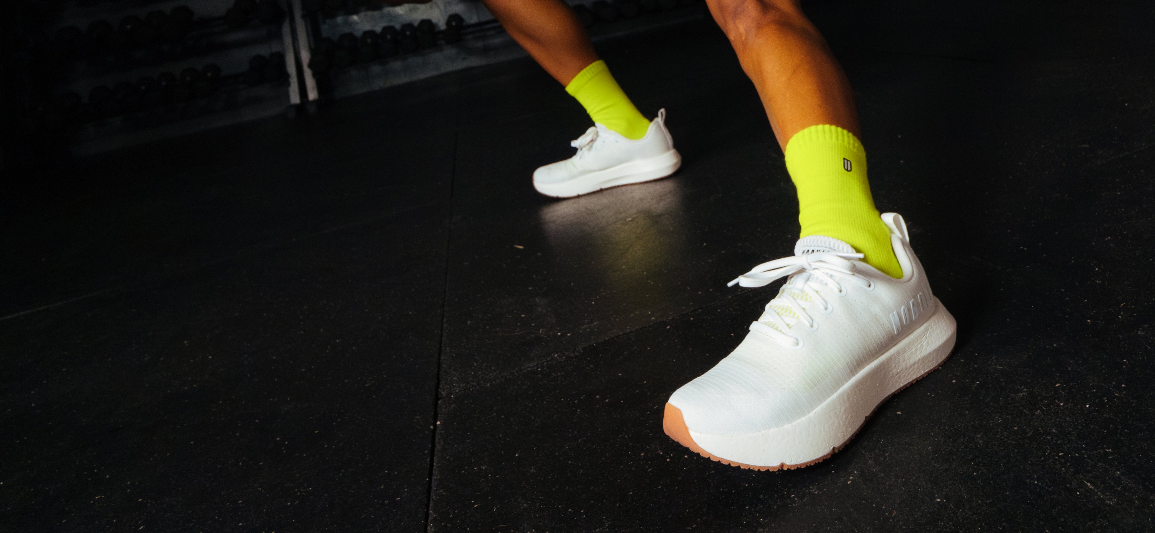 White Drive Ripstop with yellow socks on a dark floor