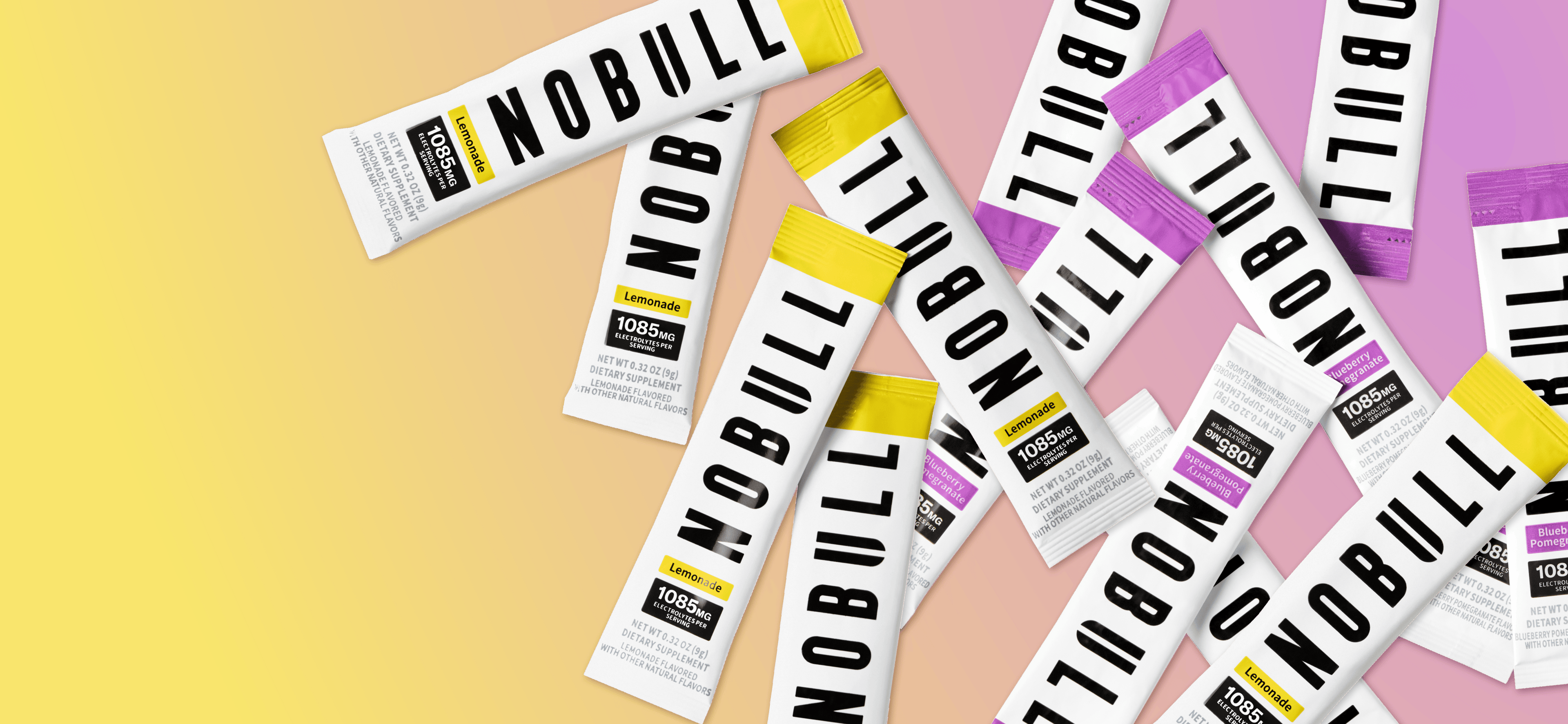 promo - Multiple NOBULL electrolyte packets on a colorful background