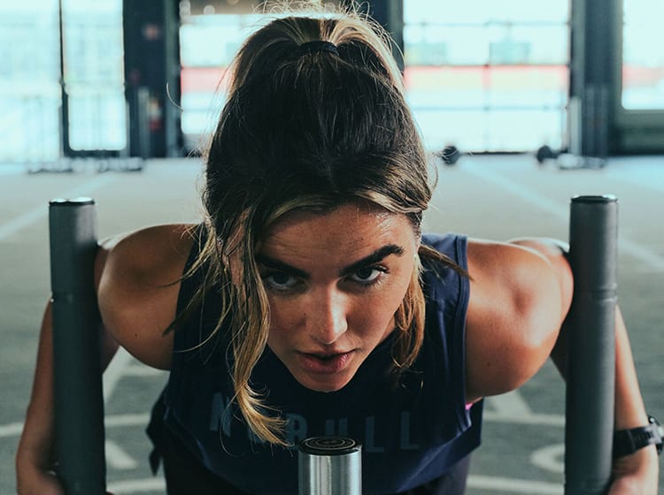 promo - woman pushing sled