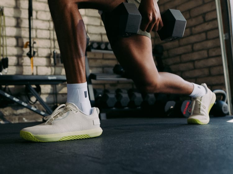 promo - Person wearing white outwork flex shoes with zest sole in a gym setting