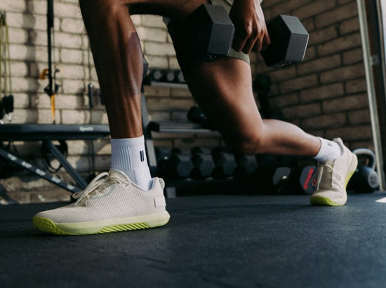 promo - Person wearing white outwork flex shoes with zest sole in a gym setting