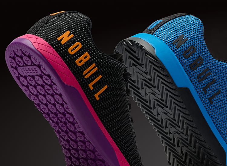 product - Three athletic shoes shown from the side and back against a dark gradient background, featuring the NOBULL brand name on the sides. The shoes display vibrant colorways: black with magenta and orange, blue with black and light blue, and teal with mint green and white.