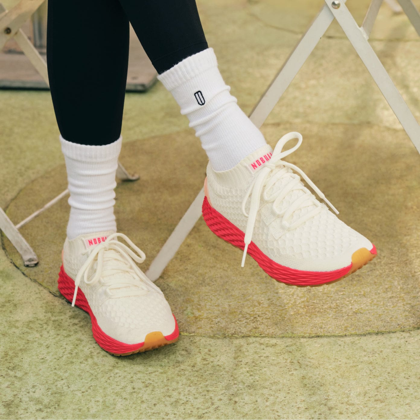 Close up shot of woman wearing the classic white punch allday knit