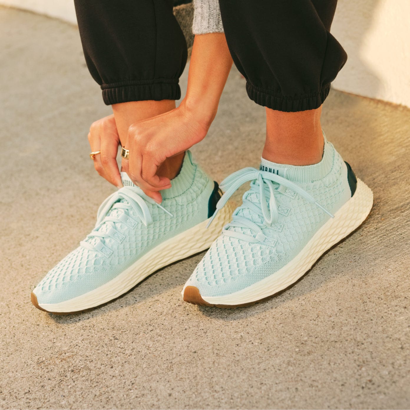 woman wearing the blue haze midnight allday knit shoes