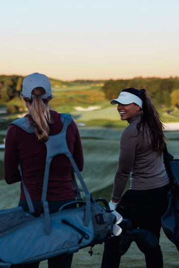 Two women golfing.