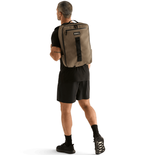 Man Wearing NOBULL Fallen Rock Waxed Backpack On Body Shot.