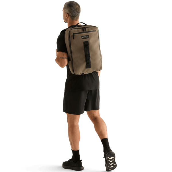 Man Wearing NOBULL Fallen Rock Waxed Backpack On Body Shot.