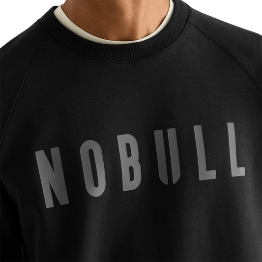 Men's Black NOBULL Layers Crew Sweatshirt detail on body angle.