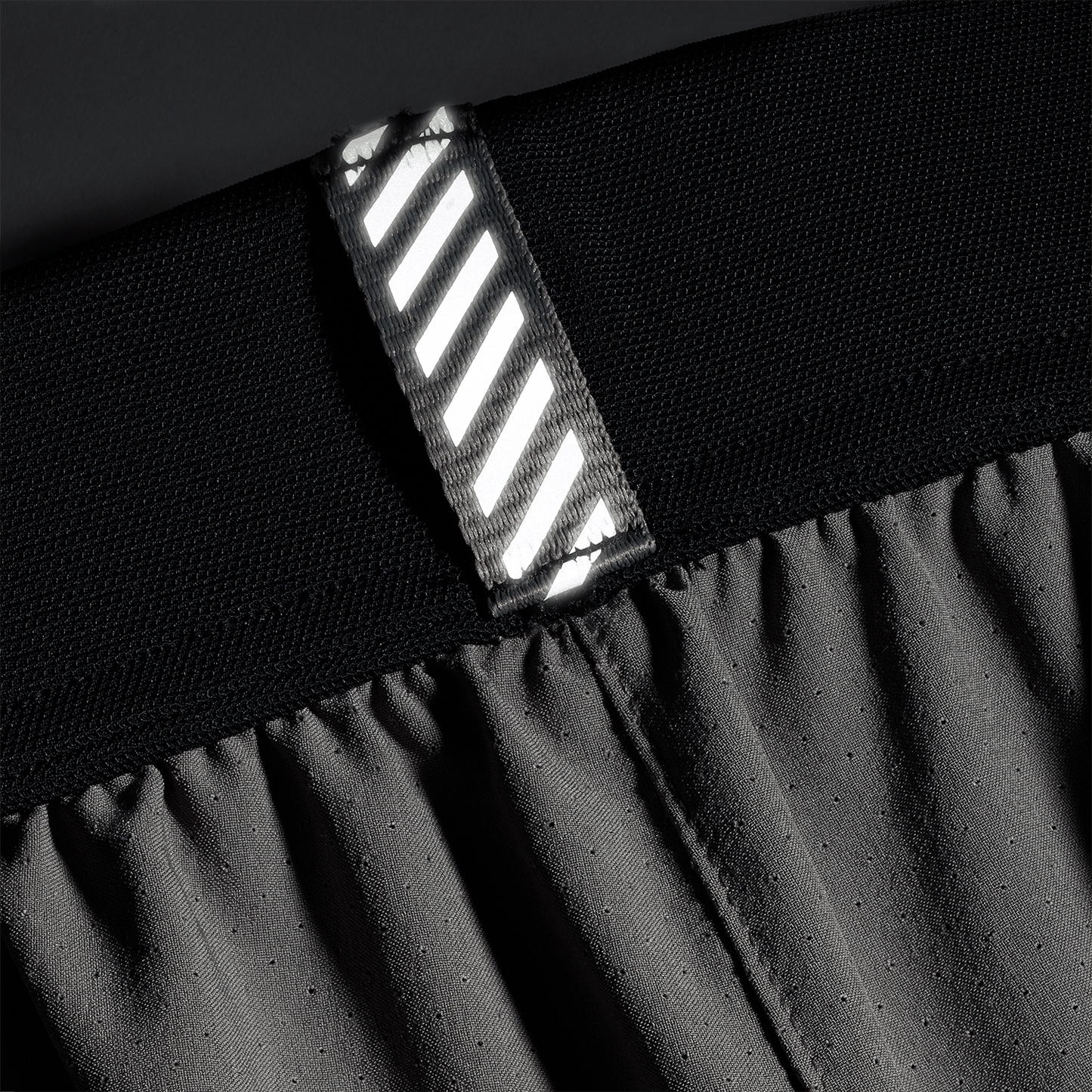 Men's Gargoyle NOBULL Drive Short 6" (Lined) Reflective Tab Detail Angle.