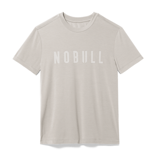 
                        Men's Oatmeal NOBULL Tee Flat Lay Angle.
                      