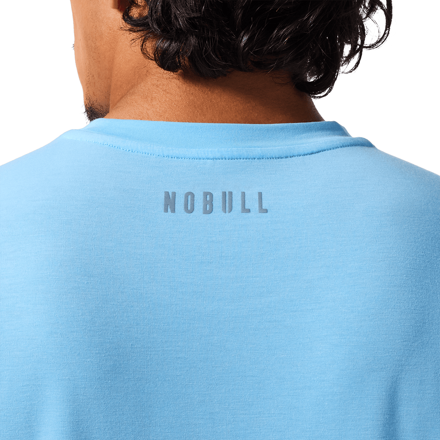 Men's Alaskan Blue U Tee Back Detail On Body Angle.