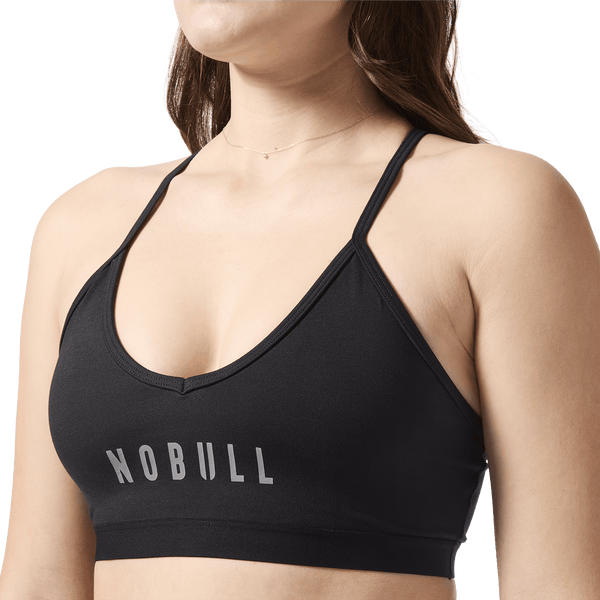 Matte Black NOBULL V-Neck Sports Bra Front Close Up On Body Angle.