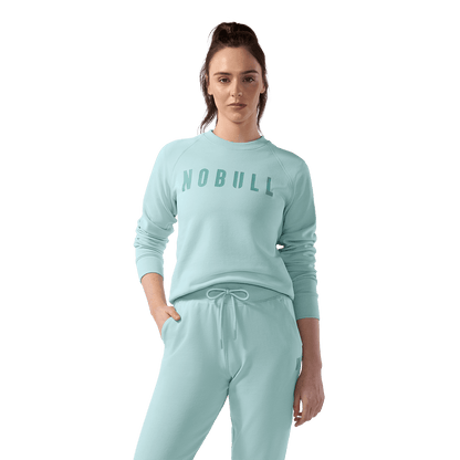 Women's Blue Haze NOBULL Crew Sweatshirt Front On Body Angle.