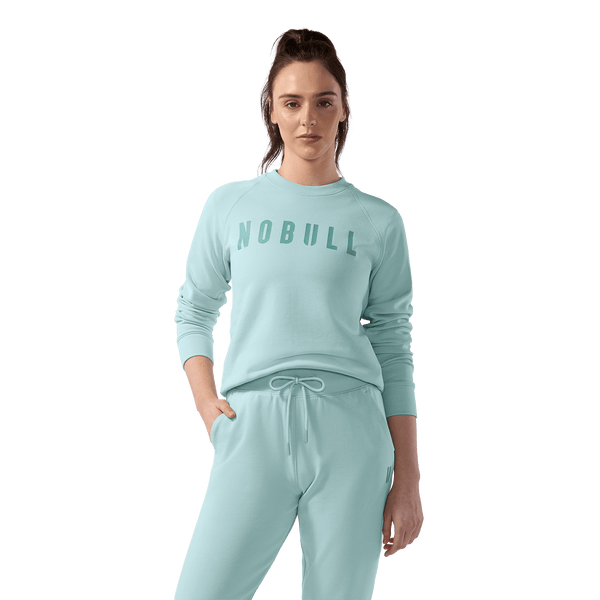 Women's Blue Haze NOBULL Crew Sweatshirt Front On Body Angle.