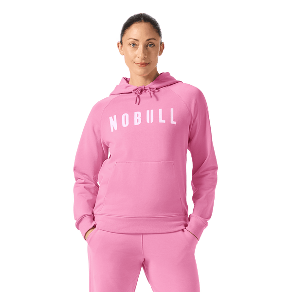 Women's Soft Pink NOBULL Hoodie Front Waist Up Angle.