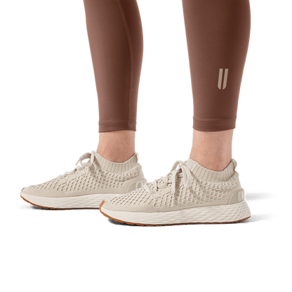 Women's Acorn U High-Rise Matte Tight 28" Footwear Angle.