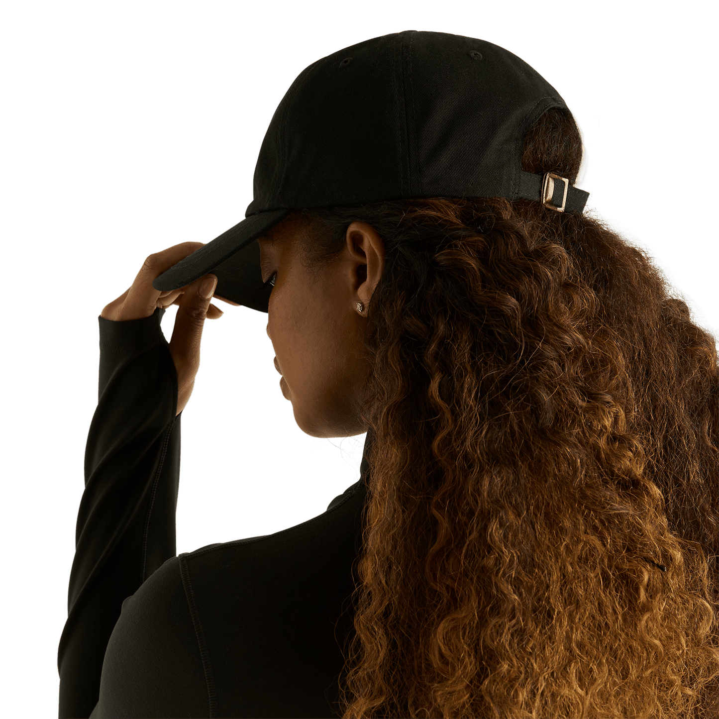Woman wearing black NOBULL hat - back facing