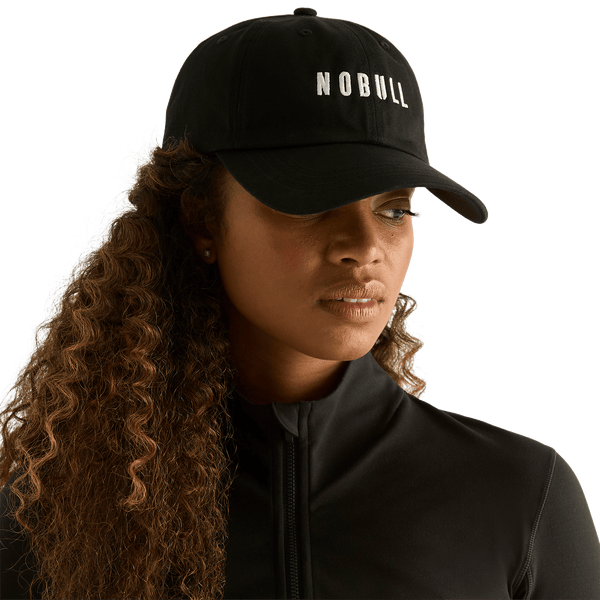 Woman wearing black NOBULL hat - front facing