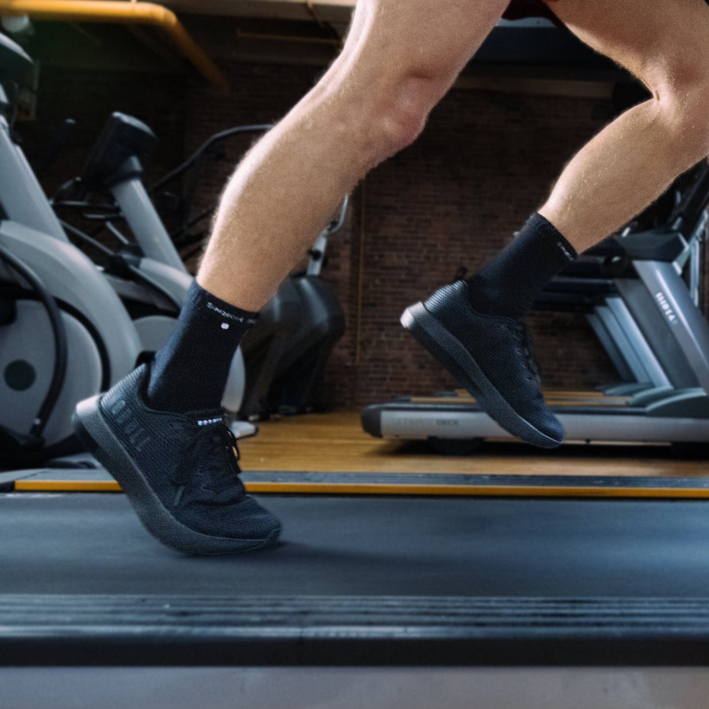 Men's Triple Black Drive Mesh Shoes On Body Angle.