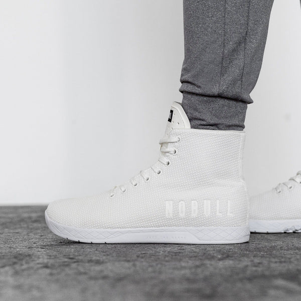 Men's White Outwork High-Top Shoes On Body Angle.