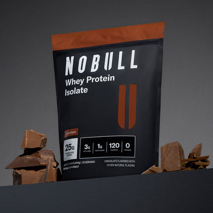 Chocolate NOBULL whey protein isolate package with chocolate pieces on a gray background