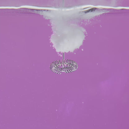 Video of electrolyte powder being mixed in with water on a purple background